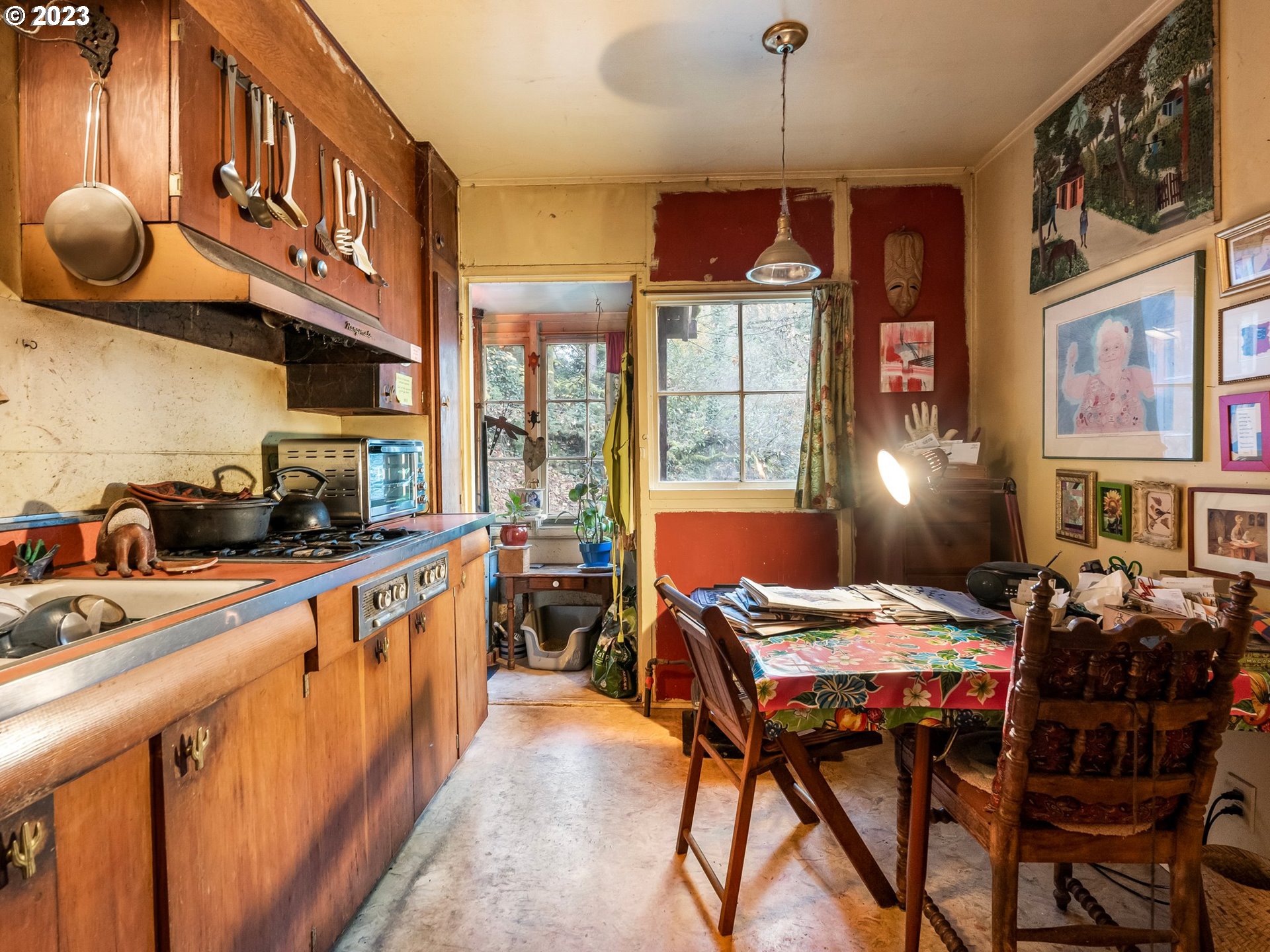 3852 Southwest Condor Avenue Portland, OR 97239 - Photo 18 of 44 a kitchen that has a table and chairs in it