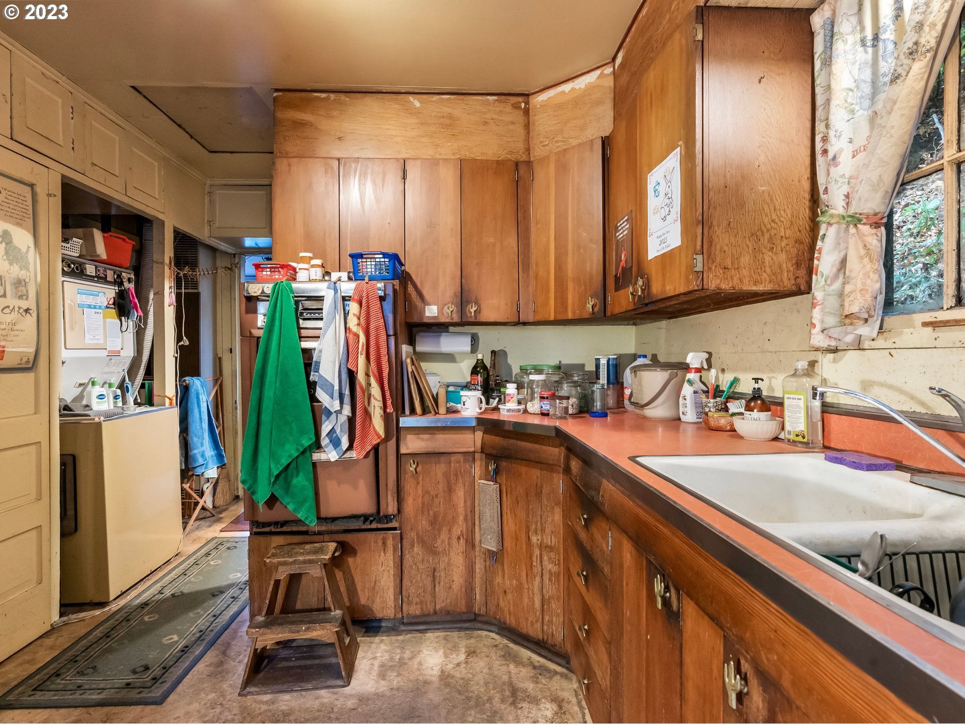 3852 Southwest Condor Avenue Portland, OR 97239 - Photo 19 of 44 a kitchen with lots of counter top space and a sink