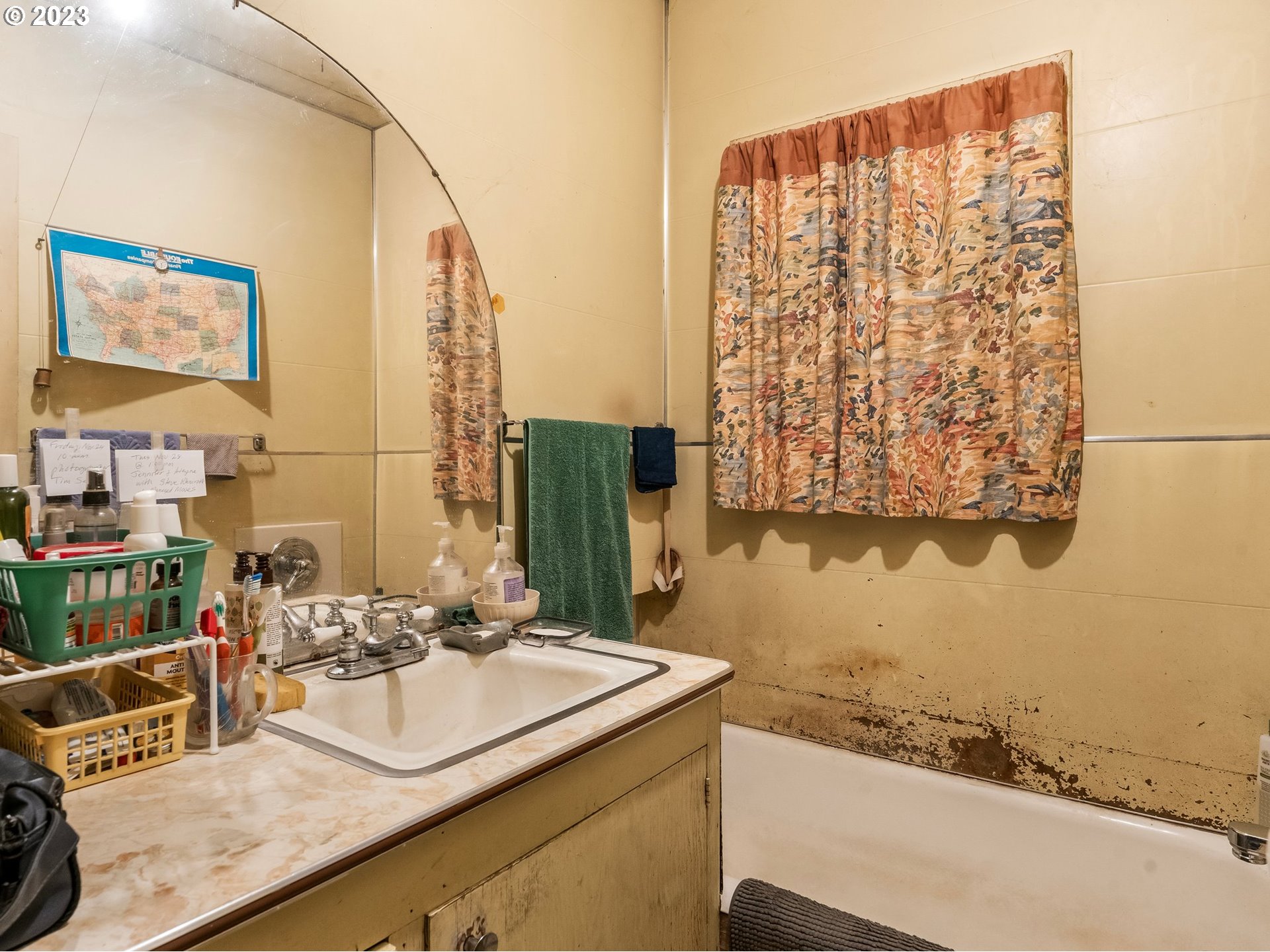 3852 Southwest Condor Avenue Portland, OR 97239 - Photo 21 of 44 a bathroom with a granite countertop sink and a mirror