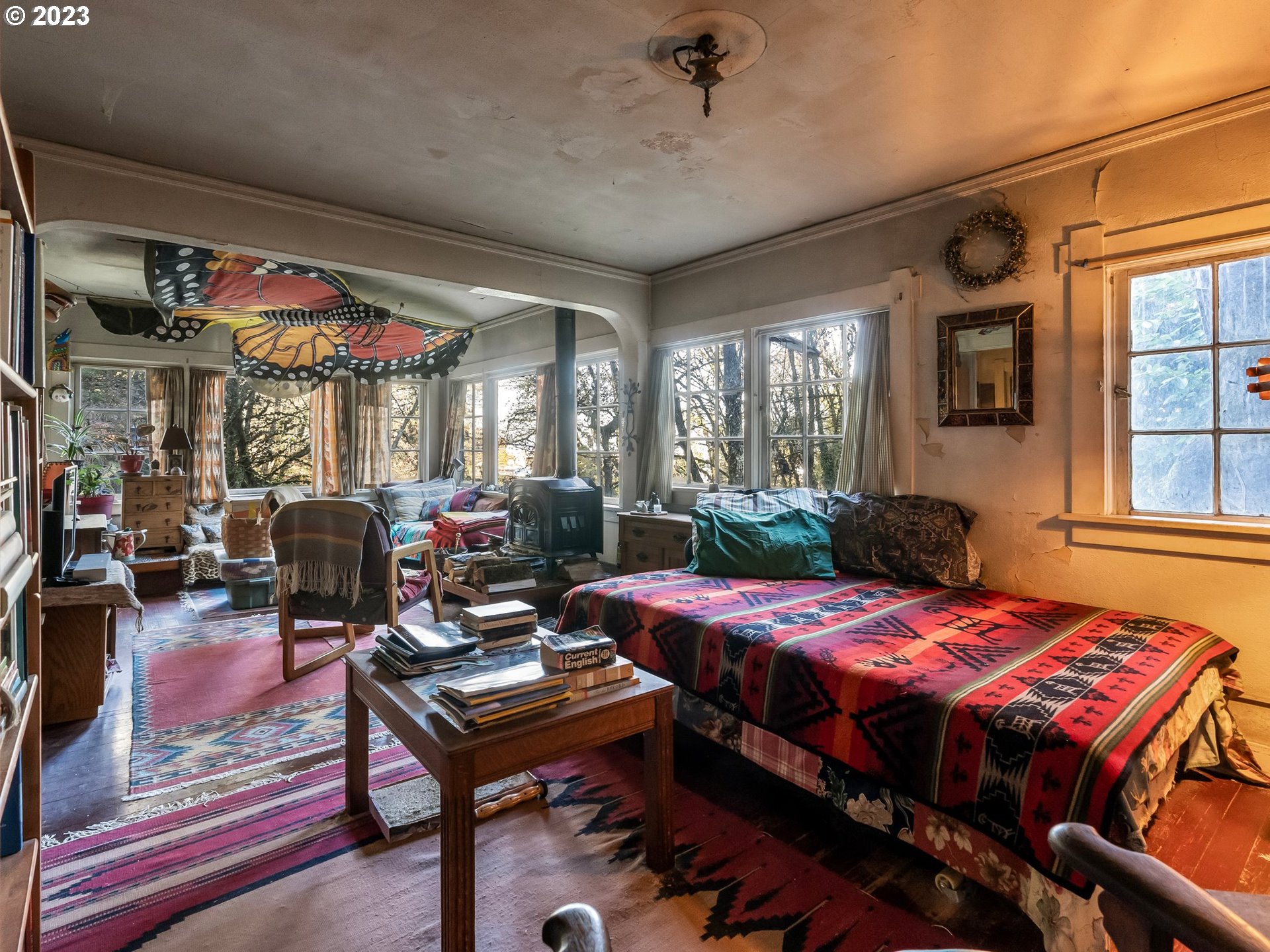 3852 Southwest Condor Avenue Portland, OR 97239 - Photo 23 of 44 a bedroom with furniture and a large window