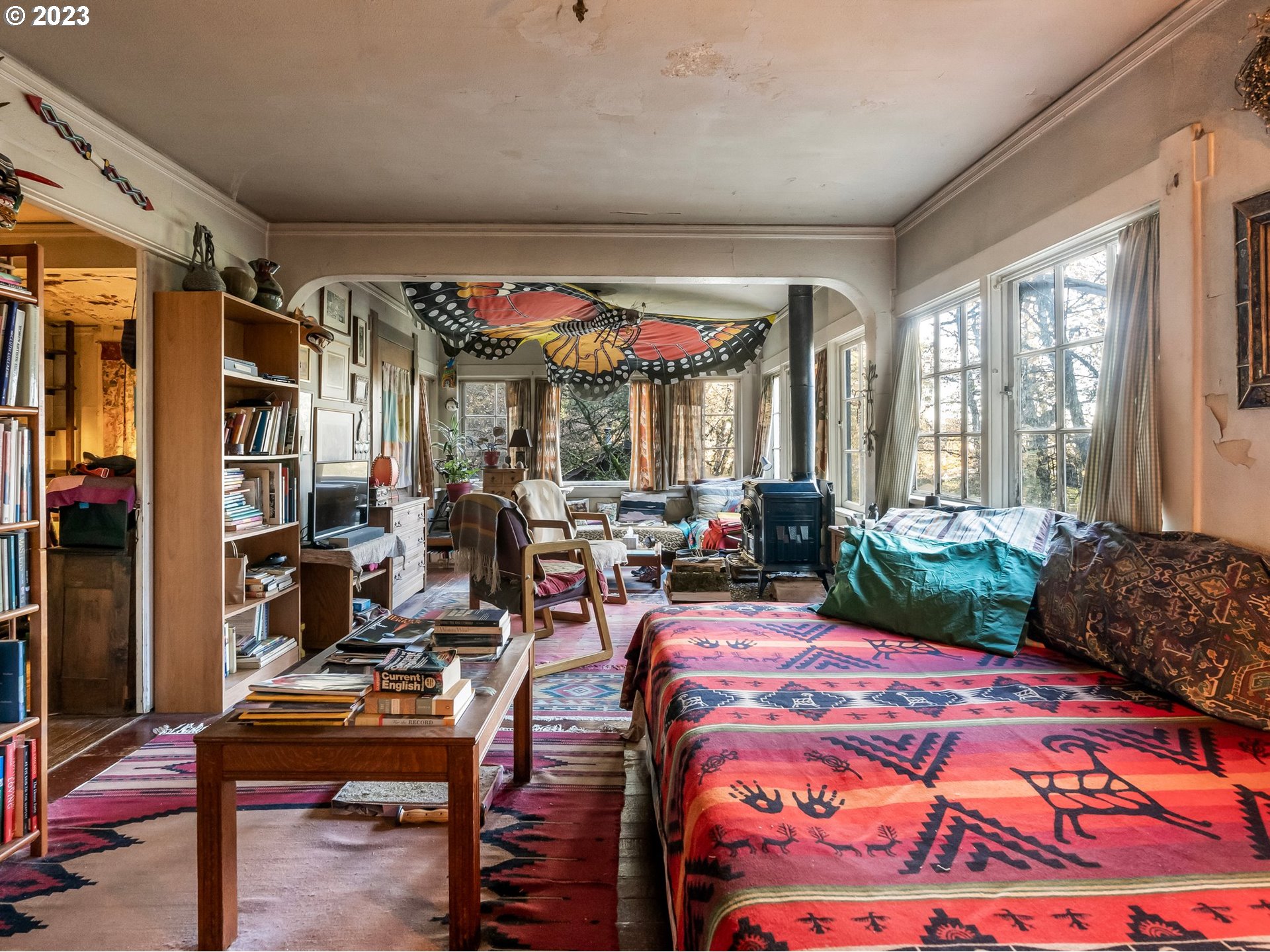 3852 Southwest Condor Avenue Portland, OR 97239 - Photo 24 of 44 a bedroom with furniture and large windows
