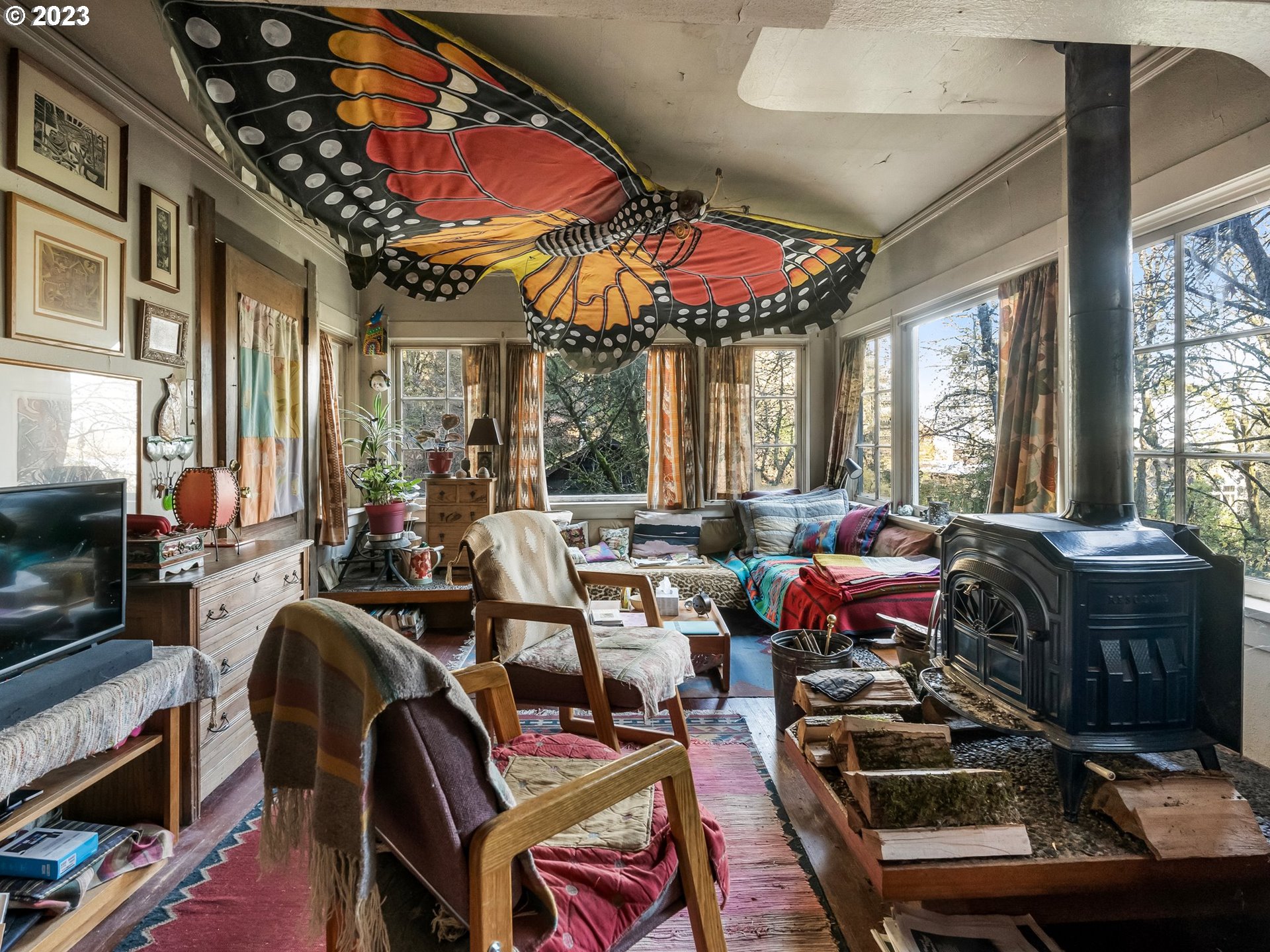 3852 Southwest Condor Avenue Portland, OR 97239 - Photo 27 of 44 a room with furniture a flat screen tv and a window
