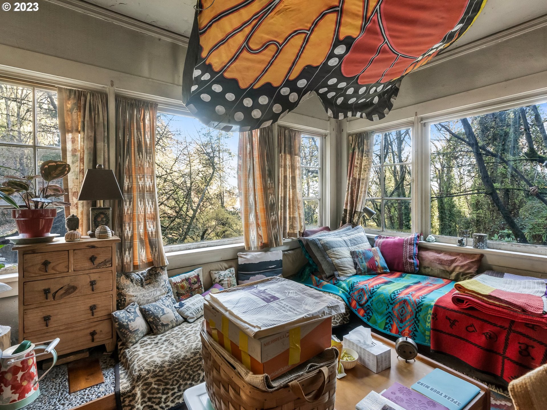 3852 Southwest Condor Avenue Portland, OR 97239 - Photo 28 of 44 a living room with lots of furniture and a chandelier