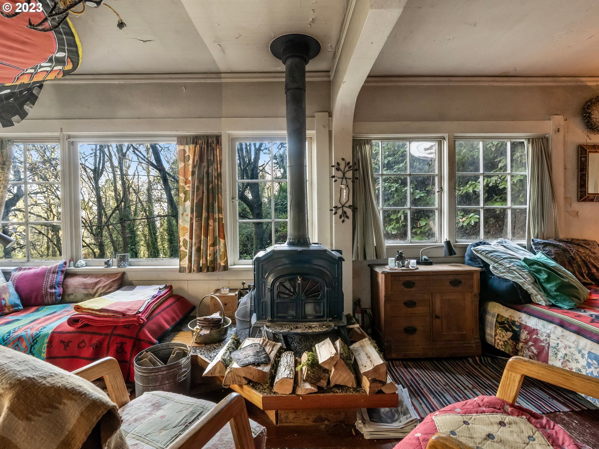 3852 Southwest Condor Avenue Portland, OR 97239 - Photo 29 of 44 a living room with furniture and a floor to ceiling window