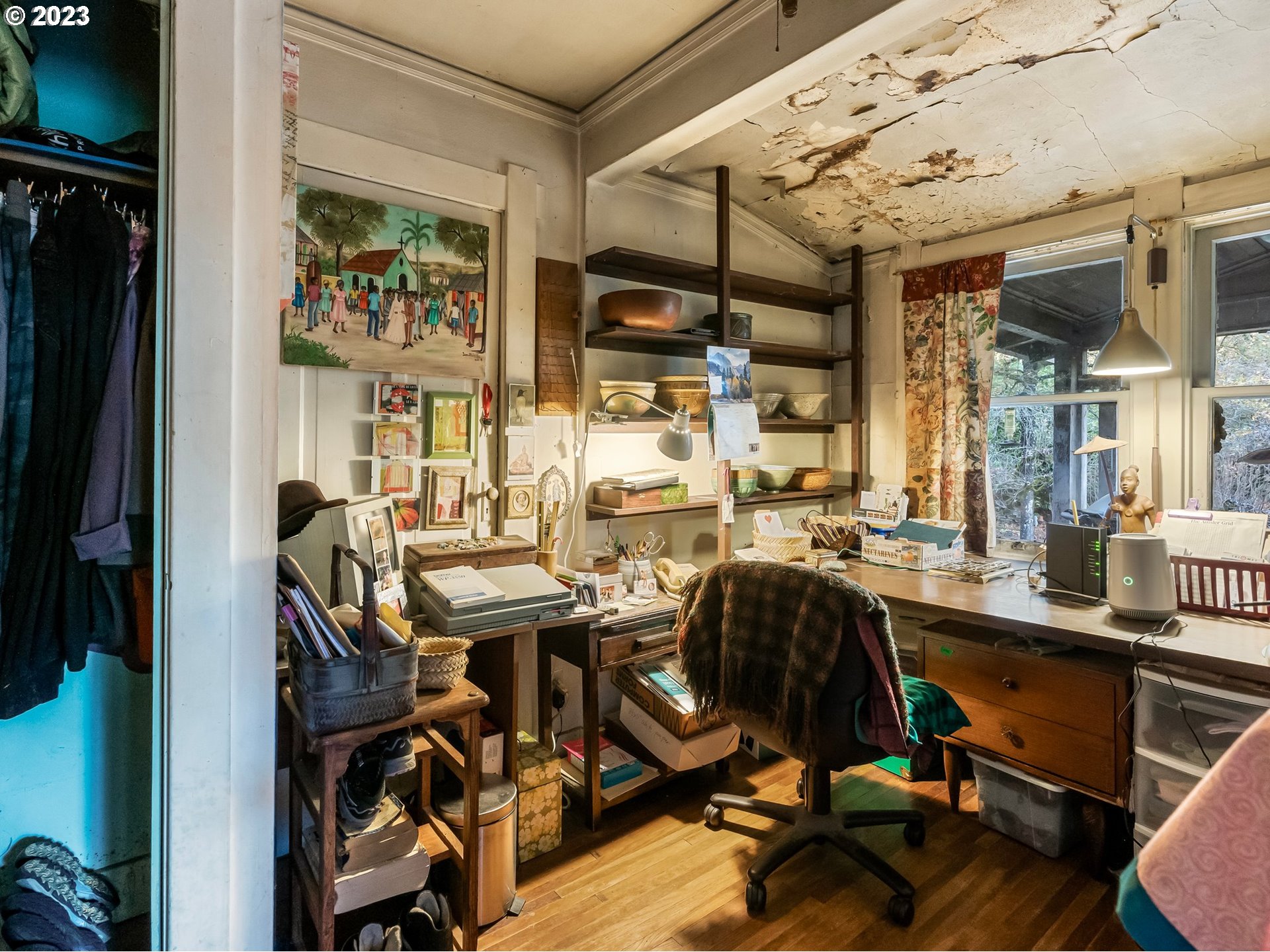 3852 Southwest Condor Avenue Portland, OR 97239 - Photo 31 of 44 a view of a workspace with furniture and a window