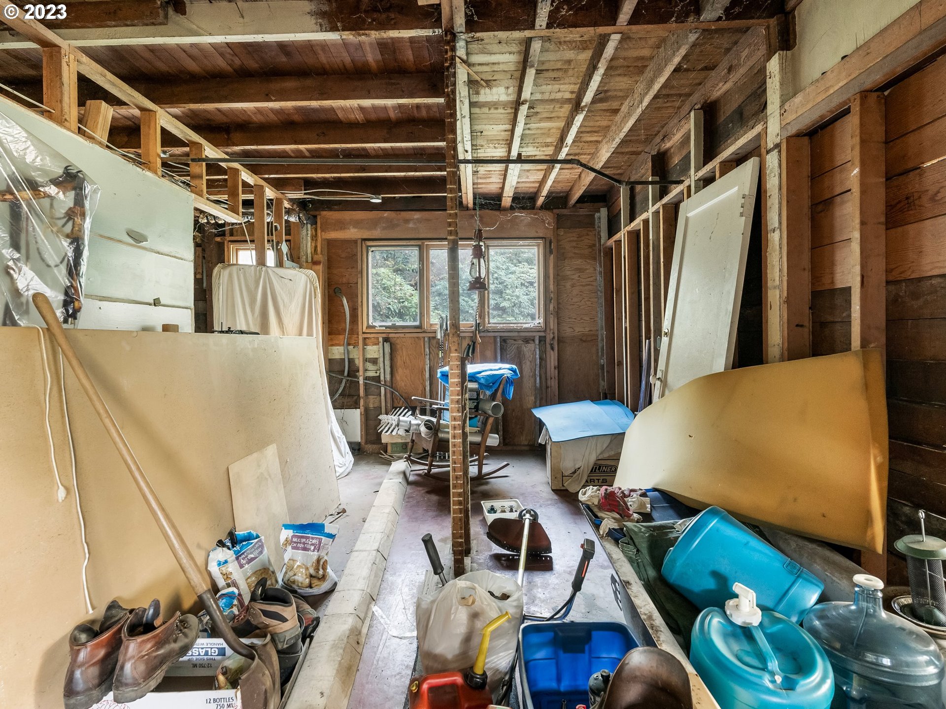 3852 Southwest Condor Avenue Portland, OR 97239 - Photo 34 of 44 a living room with furniture and a chandelier