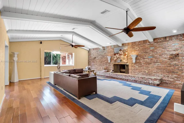 a living room with a couch and a fireplace