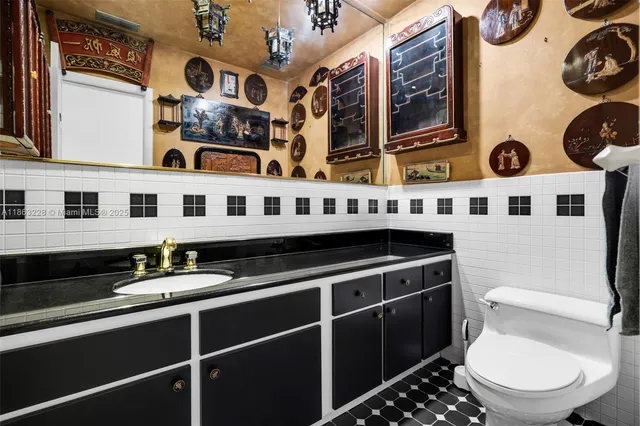 a bathroom with a toilet a sink and a shower