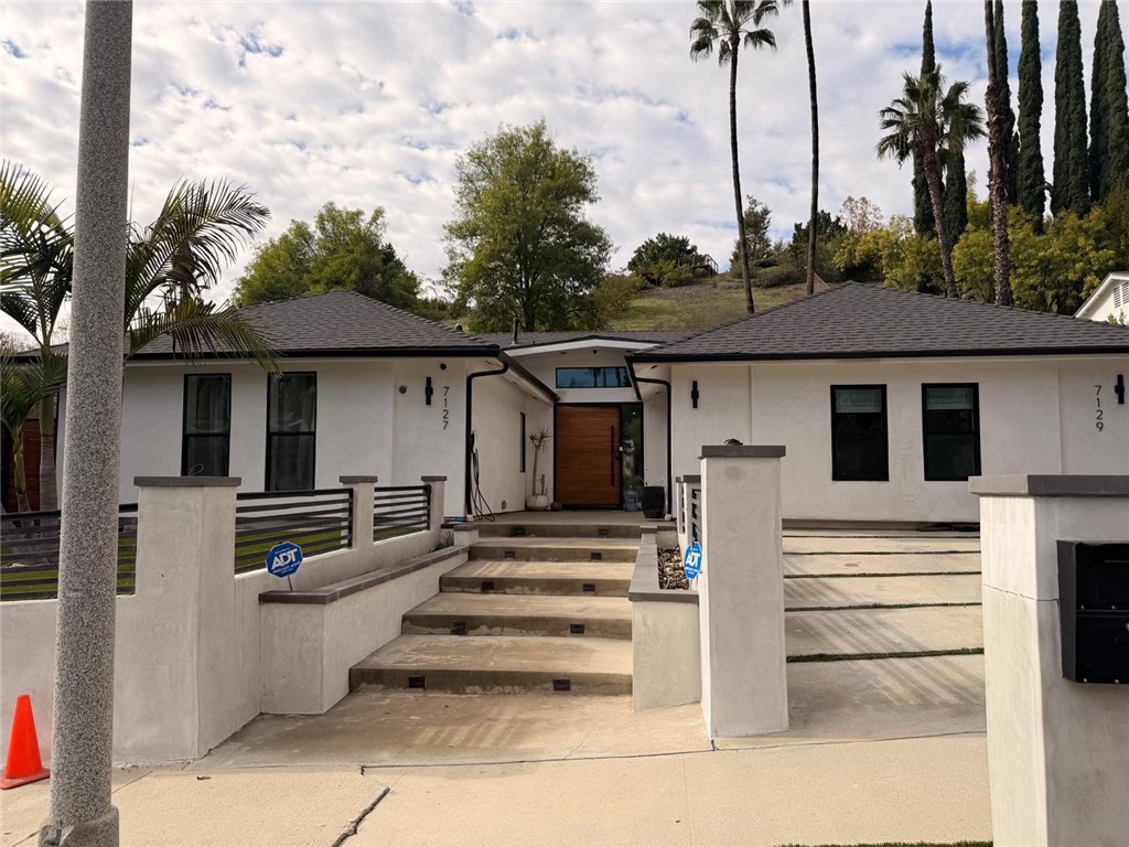 a front view of a house with a porch