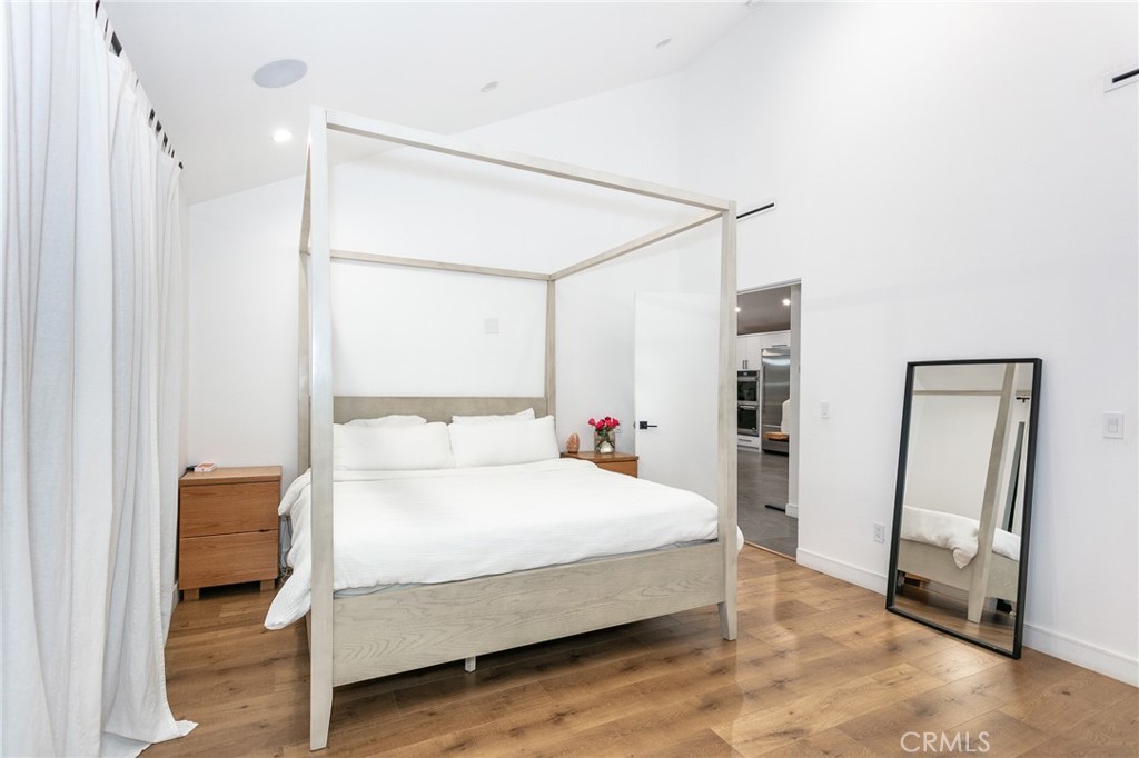 7127 Forest Hills Road West Hills, CA 91307 - Photo 14 of 37 a bedroom with a bed and a refrigerator