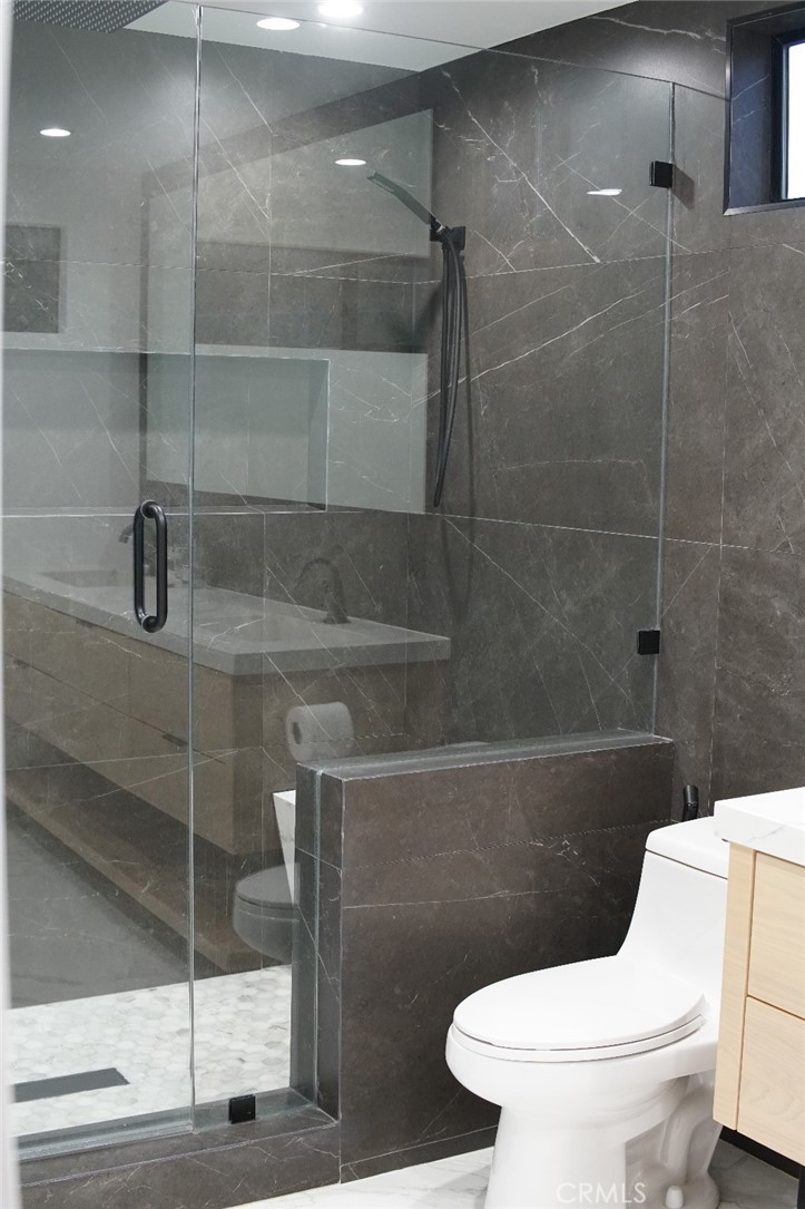 7127 Forest Hills Road West Hills, CA 91307 - Photo 18 of 37 a white toilet sitting next to a bathroom sink