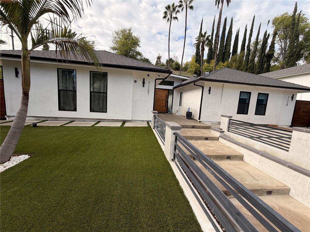 7127 Forest Hills Road West Hills, CA 91307 - Photo 2 of 37 a front view of a house with garden