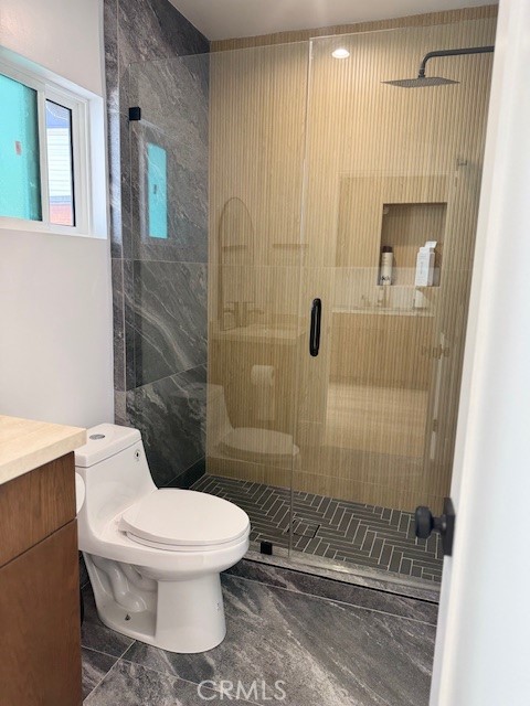 7127 Forest Hills Road West Hills, CA 91307 - Photo 24 of 37 a white toilet sitting next to a bathroom sink