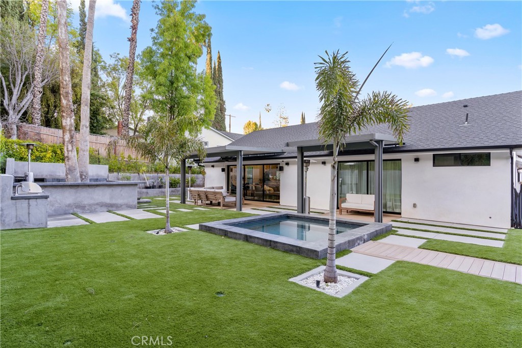 7127 Forest Hills Road West Hills, CA 91307 - Photo 30 of 37 a backyard of a house with table and chairs
