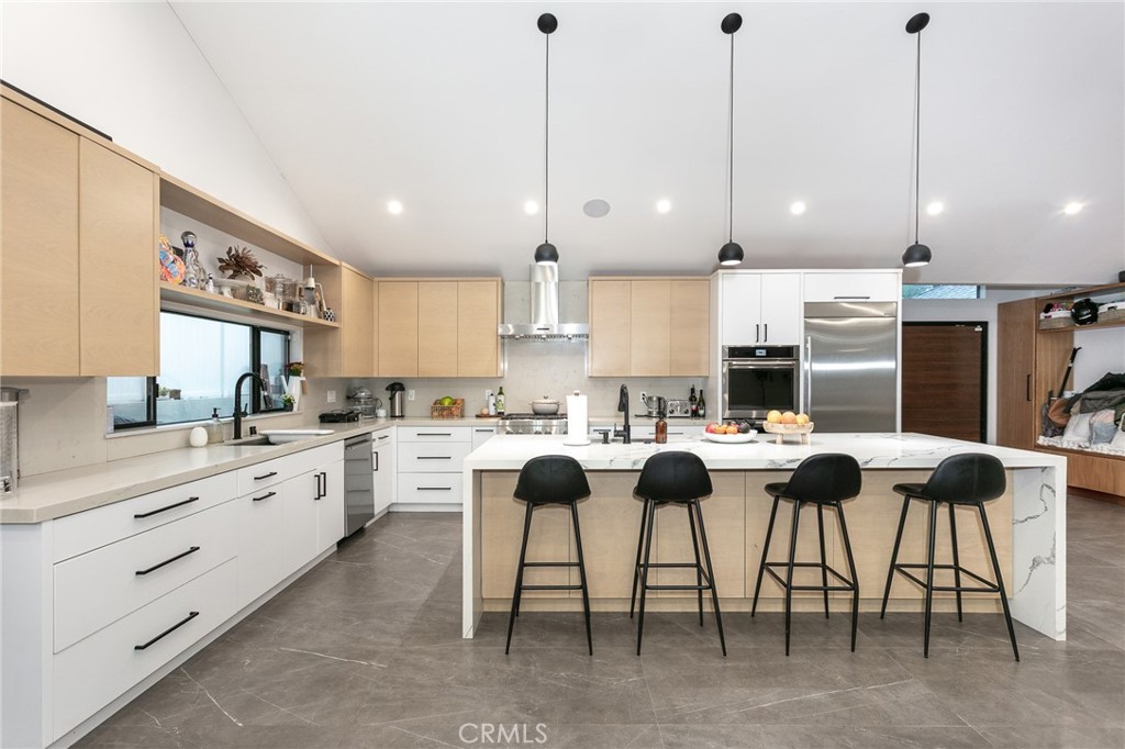 7127 Forest Hills Road West Hills, CA 91307 - Photo 10 of 37 a kitchen with granite countertop lots of white cabinets and stainless steel appliances