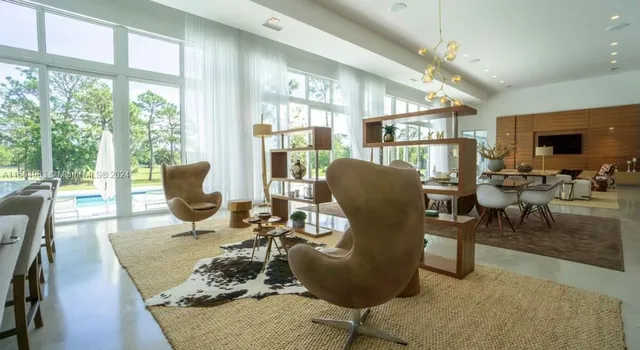 a kitchen with stainless steel appliances a sink stove and cabinets