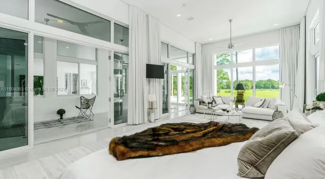 a bathroom with a double vanity sink a mirror and bathtub