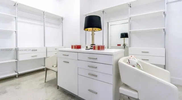 a workspace with furniture and a bathroom