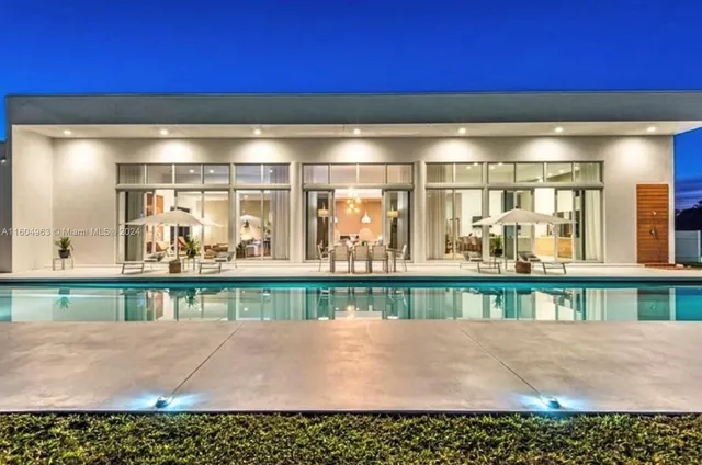 a view of a swimming pool with a lounge chairs
