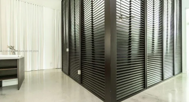 a bathroom with a sink mirror and window