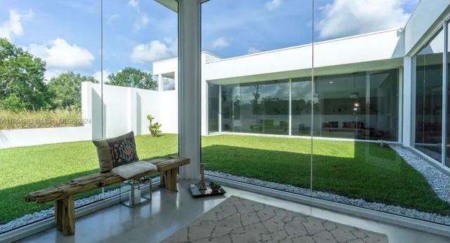 a bathroom with a sink and a large window