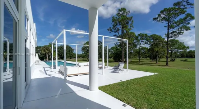 a view of a patio with a yard