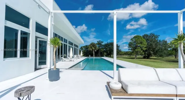 a view of a patio with swimming pool
