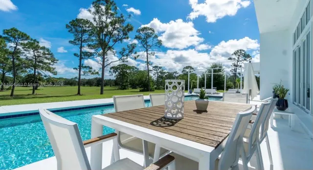 a view of swimming pool with a backyard