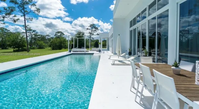a view of swimming pool with a backyard