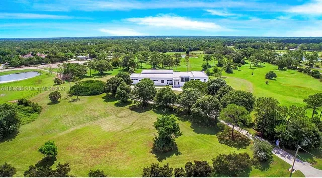 a view of a lake and houses in the background