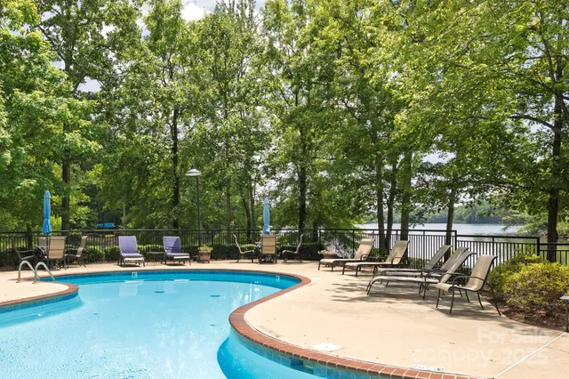 a view of a swimming pool with chairs