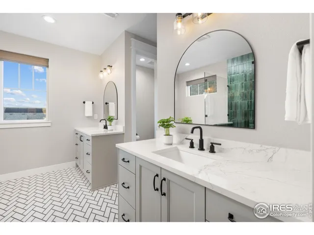 a bathroom with a sink a vanity and a mirror
