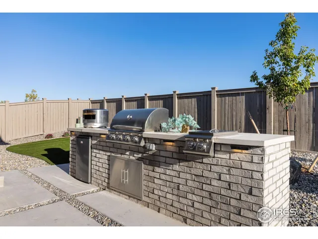 a view of a house with backyard porch and sitting area