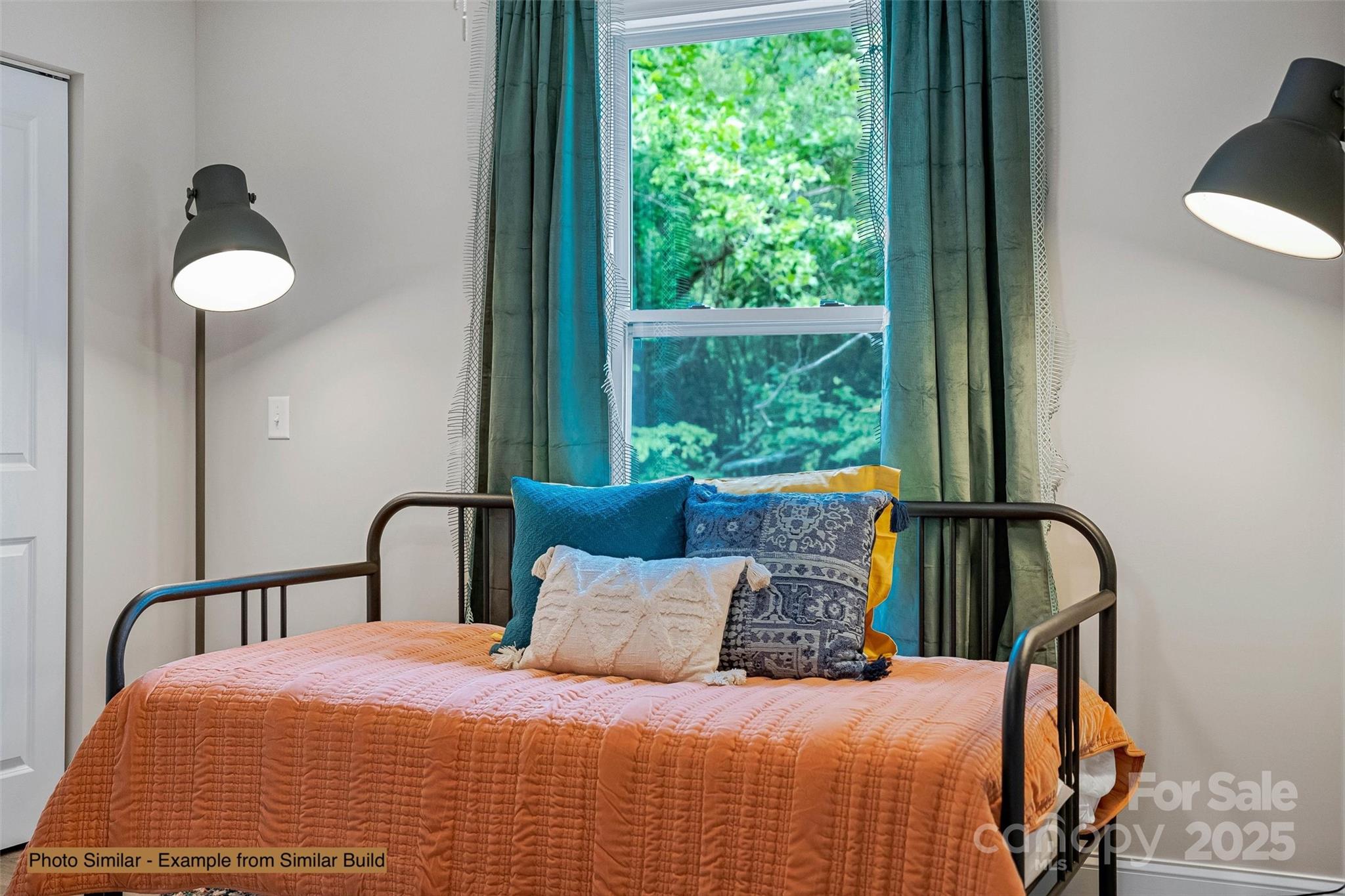 12 Holcombe Road Candler, NC 28715 - Photo 29 of 37 a bedroom with a bed and a window