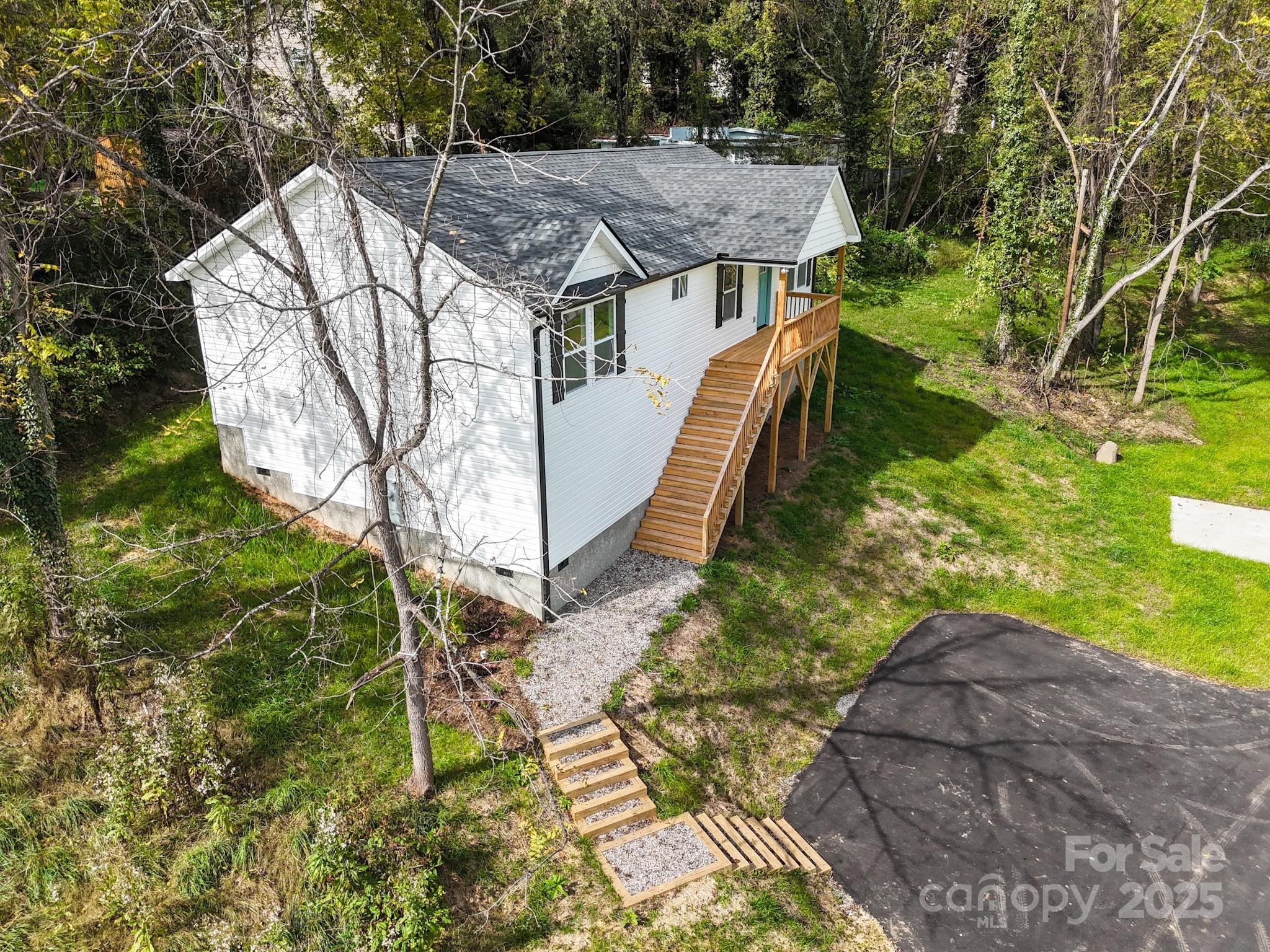 12 Holcombe Road Candler, NC 28715 - Photo 4 of 37 a view of a house with a yard
