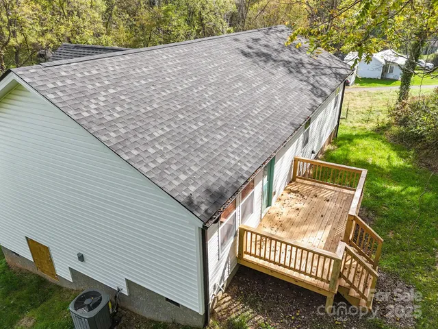 a view of a backyard with a deck
