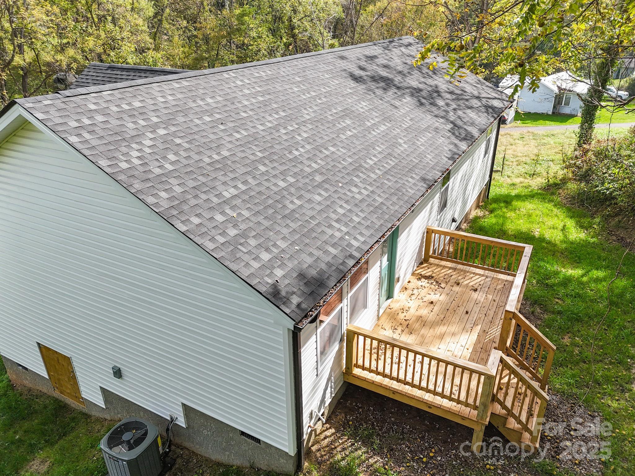 12 Holcombe Road Candler, NC 28715 - Photo 5 of 37 a view of a backyard with a deck