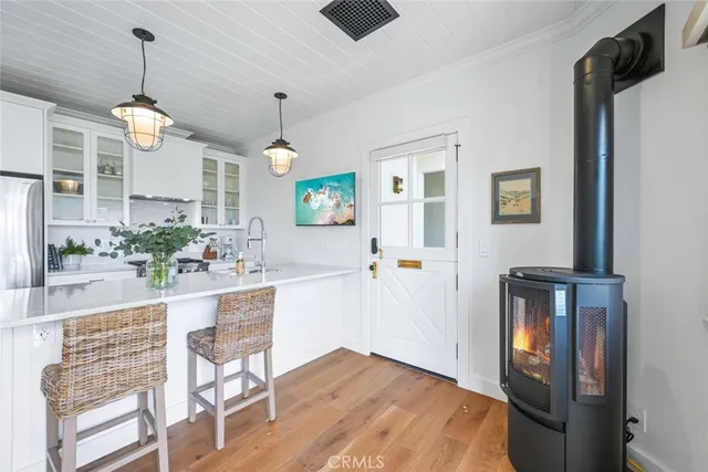 a view of an entryway with wooden floor and chandelier