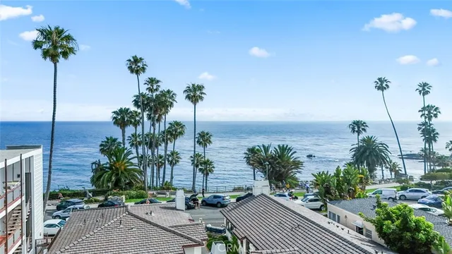 a view of a house with palm trees