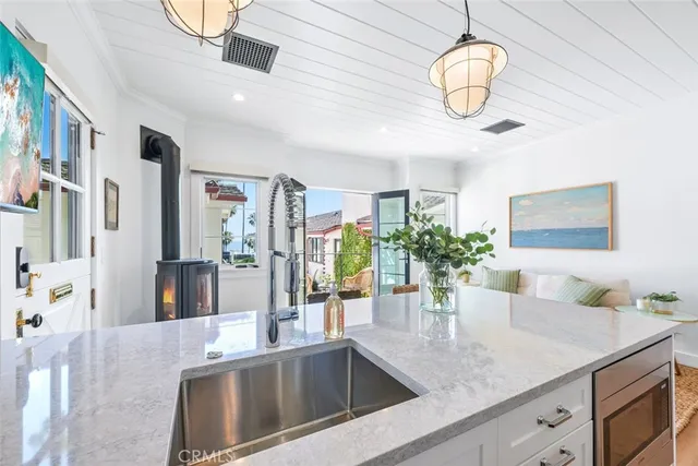 a kitchen with a counter space cabinets and stainless steel appliances