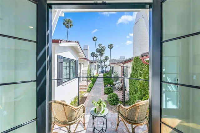 a dining room with furniture and chandelier