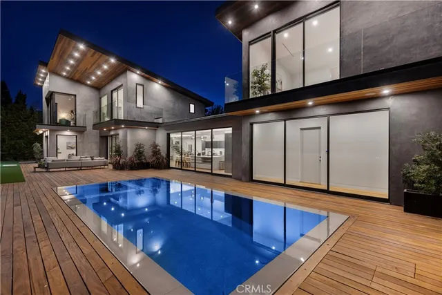 a view of swimming pool with seating space