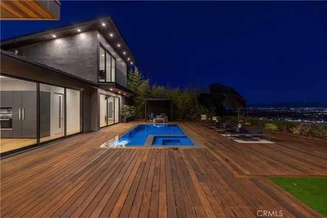 a view of outdoor space with wooden floor and barbeque oven