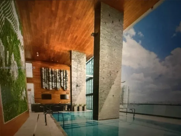a balcony with view of outdoor space