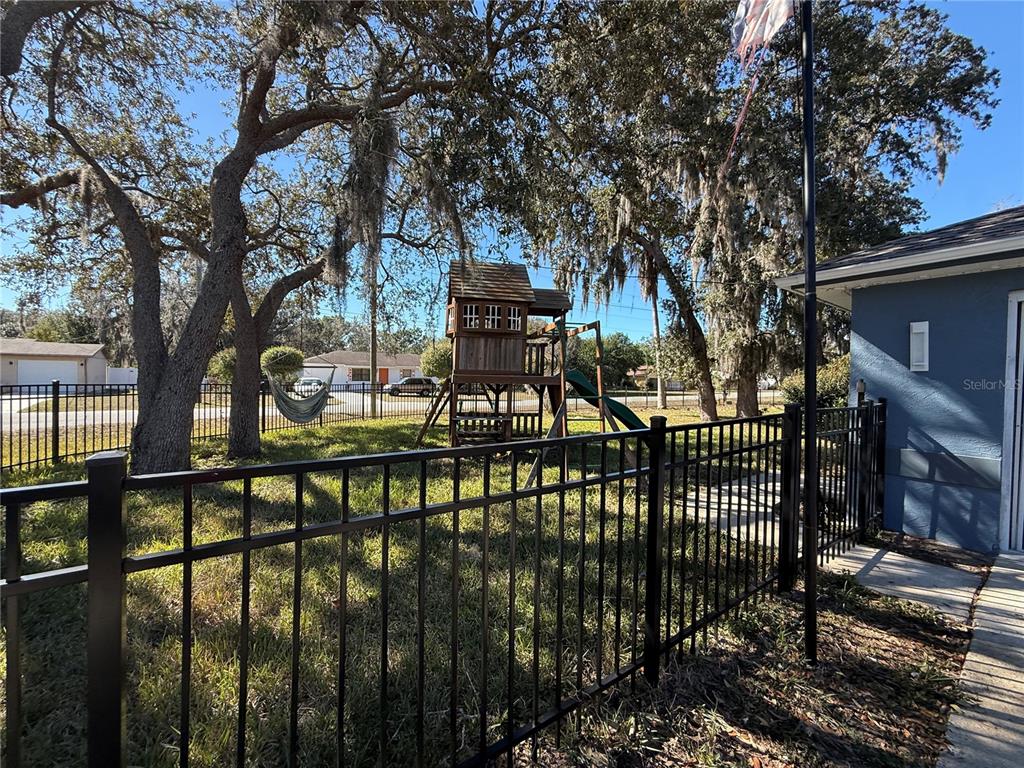 173 Portland Avenue Spring Hill, FL 34606 - Photo 2 of 5 a view of house with outdoor seating area