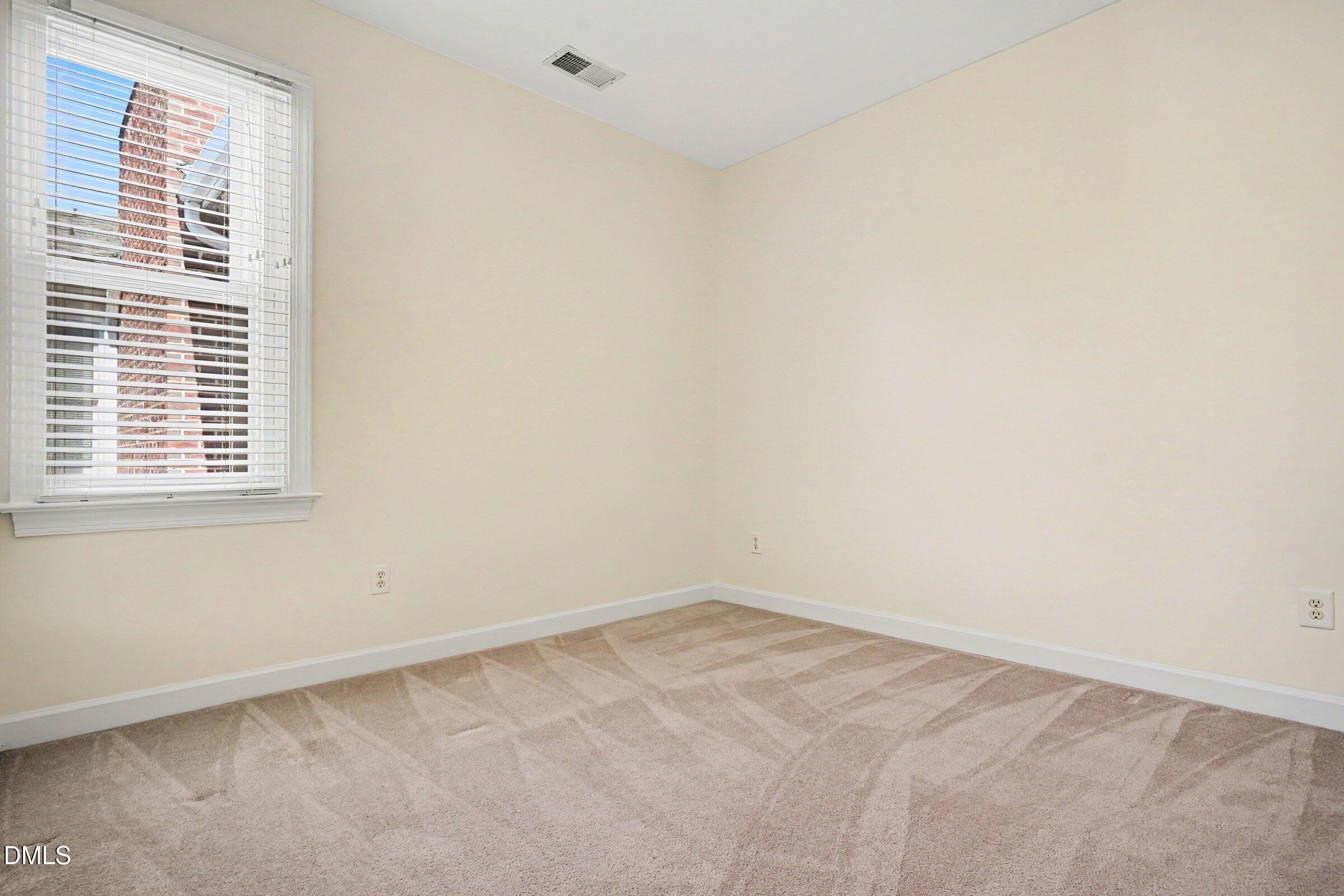 2651 Mellowfield Drive, Unit 203 Raleigh, NC 27604 - Photo 19 of 32 an empty room with a window