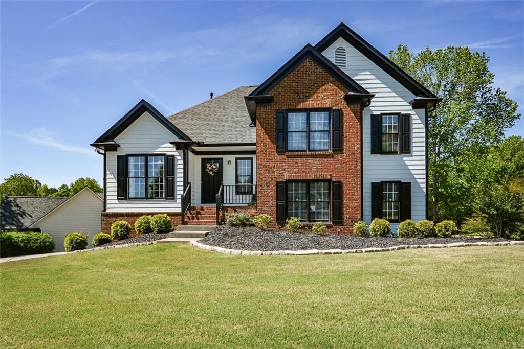 10 Arbor Hills Road South Talking Rock, GA 30175 - Photo 1 of 89 a front view of house with yard and trees in the background