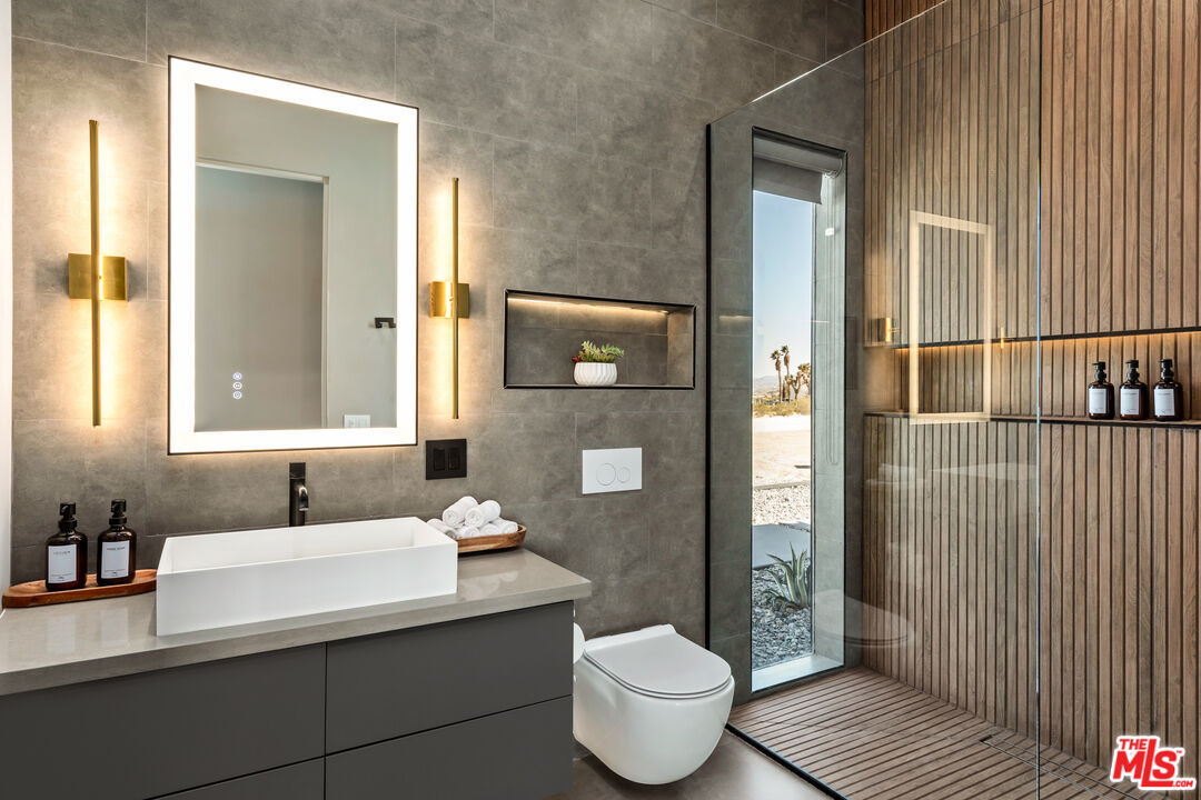 3000 Rockwood Road Joshua Tree, CA 92252 - Photo 55 of 71 a bathroom with a sink and a mirror