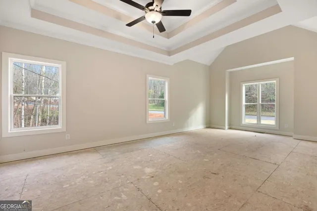 a view of a garage with a ceiling fan