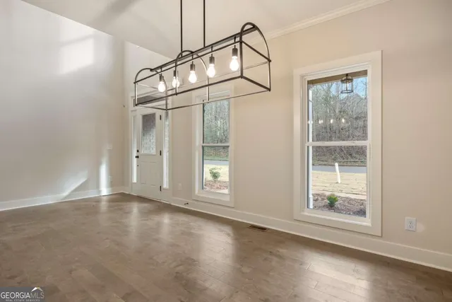 a view of an empty room with stairs